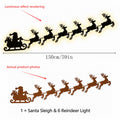 Decoración de pared navideña con Papa Noel y renos con luces